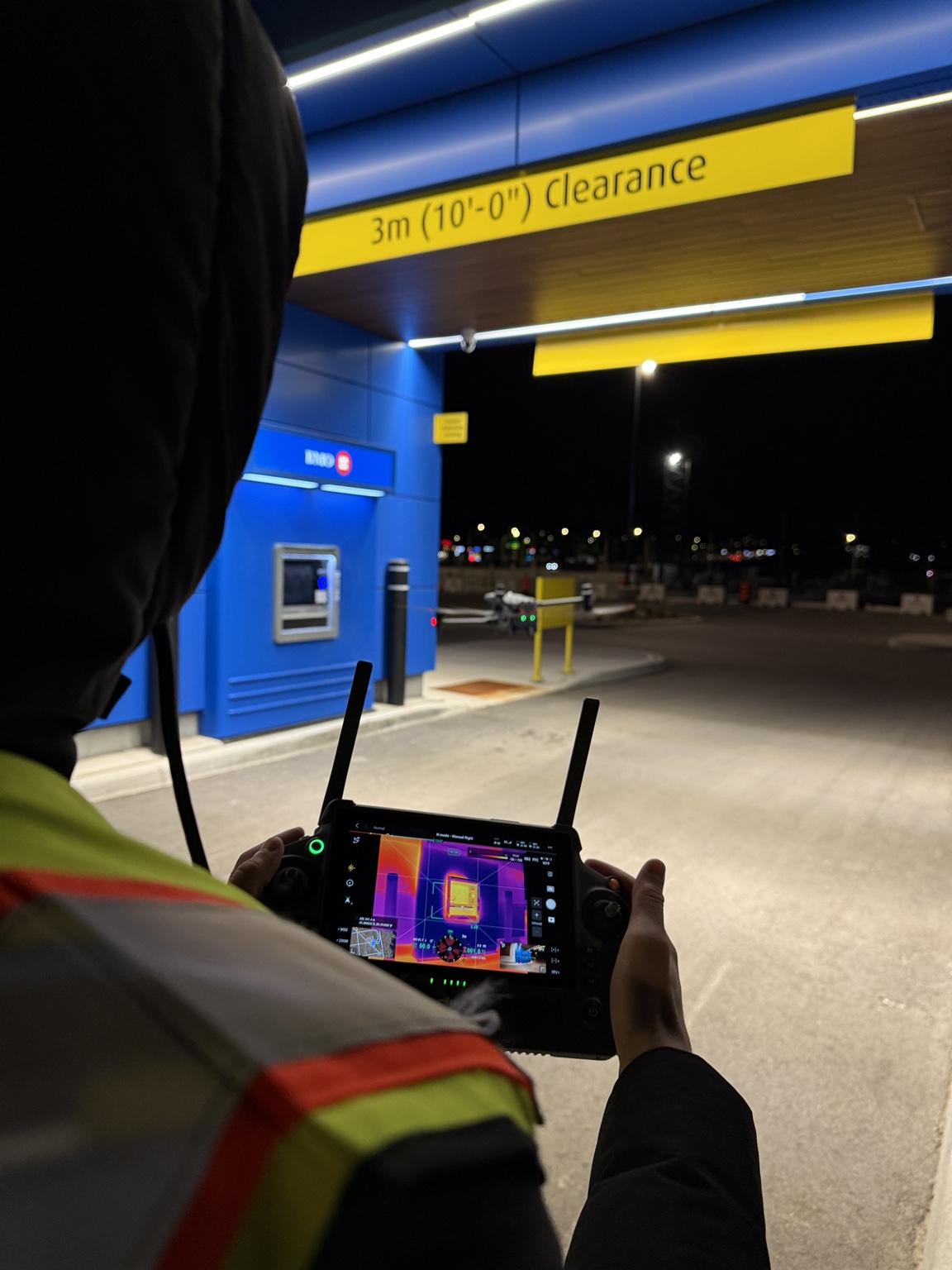 Drone operator capturing thermal inspection imagery